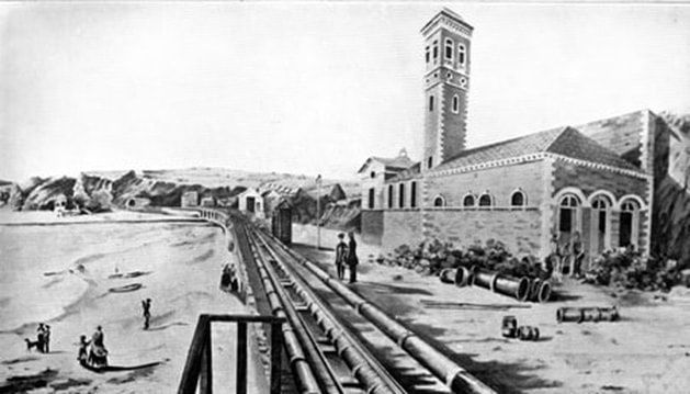 Engraving of a Brunel atmospheric railway pumping house beside tracks